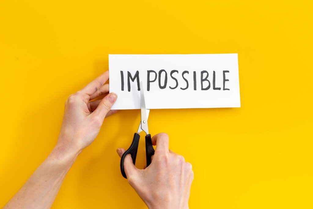 Hands,Changing,Word,Impossible,To,Possible,With,Scissors.,Selfmade
