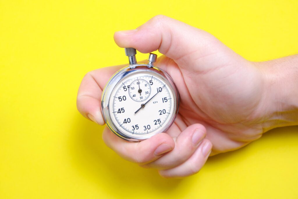 Mechanical,Stopwatch,In,A,Man's,Hand,On,