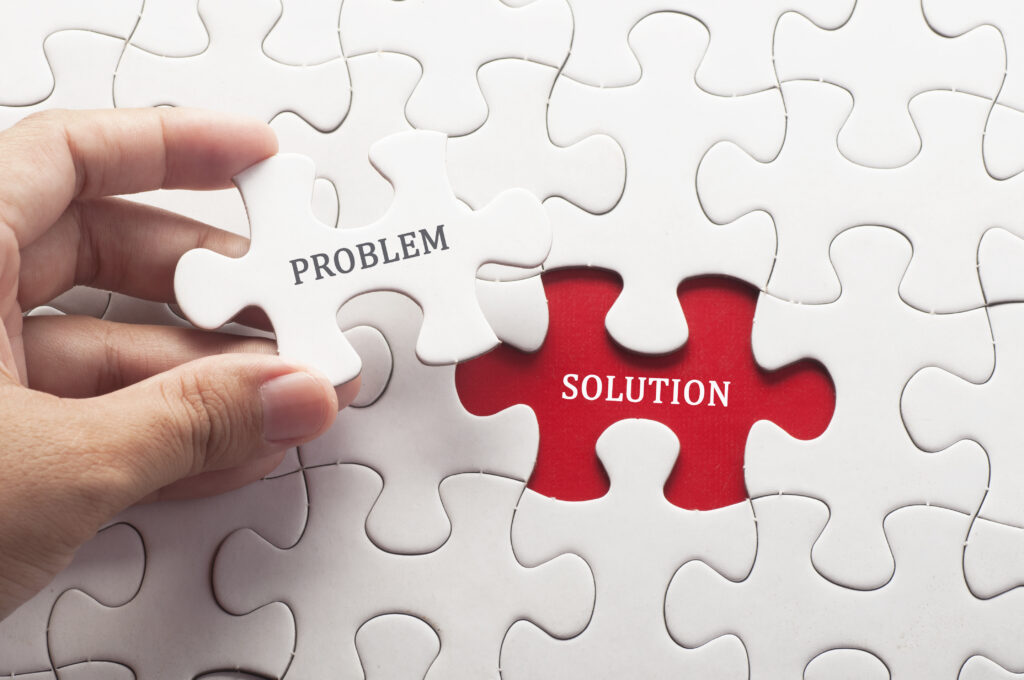 Hand,Holding,Piece,Of,Jigsaw,Puzzle,With,Word,Problem