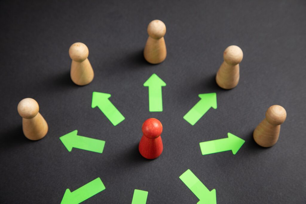 Delegation,Concept.,Wooden,Human,Figures,With,A,Arrows